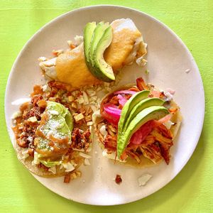 Taste of Yucatán sampler: Longaniza con Papa taco, Jackfruit Cochinita tamale, and Panucho taco.
  at Hijo De Su Madre in Los Angeles