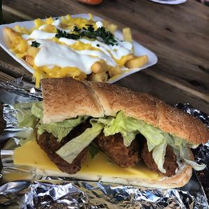 Fried chikn sandwich and chips with cheese and garlic  at Soul Shack Vegan Grill in Newcastle Upon Tyne