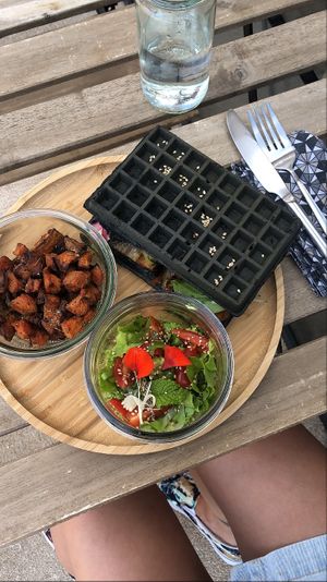 Charcoal waffle with seasonal grilled veggies and avocado & roasted sweet potatoes  at SLOW in Soorts-hossegor