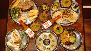 Selection of our Goodness.
Patra Burger-Masala Dosa-Raja Wrap-Pani Puri- Hearty Root Salad-Raja Bonnet Sauce at En Root in South West London