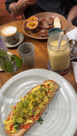 Tofu scrambled with avocado; passions fruit smoothie; coconut pancake; ginger coconut latte   at Bong Bonlai at YK Art House in Phnom Penh