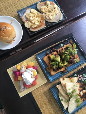 Coconut pancakes, bbq mushroom slider, bean + avocado toast, fruit salad w/ coconut cream, pita + hummus at Bong Bonlai at YK Art House in Phnom Penh