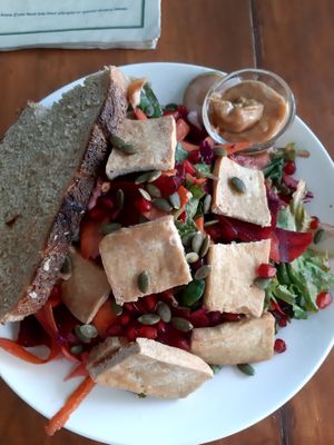 Tofu salad with herbs, variety of green leaves, vegetables and seeds served with bread and peanut butter sauce.Imbalance of lacking any sourness in my opinion.Very filling for 330r at Organic Smoothie Bowl & Cafe - Lazimpat in Kathmandu
