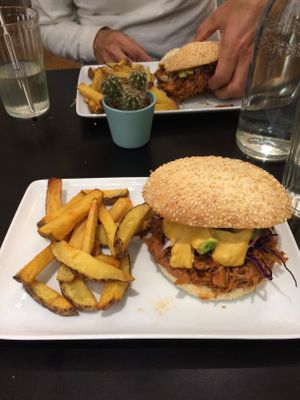 Yummy jackfruit burger with good pickles and frites.   at Bloomy in Toulouse