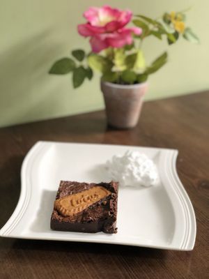 Vegan brownie and vegan whipped cream at The Humble Lotus in Morley