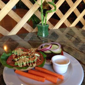 This is the Veggie Burger (black bean & quinoa). It was DELICIOUS! at Ginger's Garden Cafe in Springville