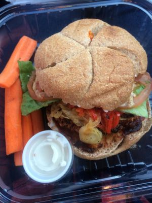 Grilled portobello burger with sauteed onions and peppers, lettuce, tomato, avocado, mustard, and vegenaise at Ginger's Garden Cafe in Springville