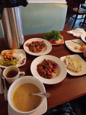 Mezze, spicy potatoes, lentil soup, bamiyeh (not on the menu), baba ghannouj, sage water at Sawa in Houston