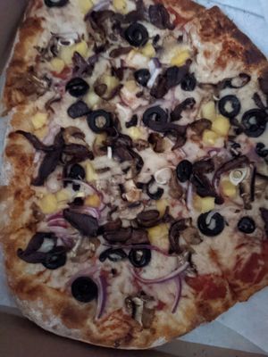Create a pizza with nomu cheese, mushroom bacon, olives, pineapple, mushrooms and red onion! So good! at Create A Pizza in Rochester