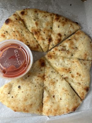 Garlic bread with alternative butter + tomato sauce  at Create A Pizza in Rochester