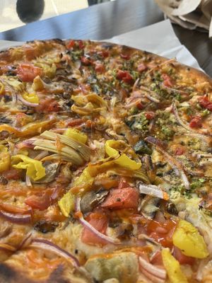 This is a fully vegan pizza, 12 inch, buffalo sauce, two types of vegan cheese (Numu and Tofu Ricotta) with all vegetable toppings.  at Create A Pizza in Rochester