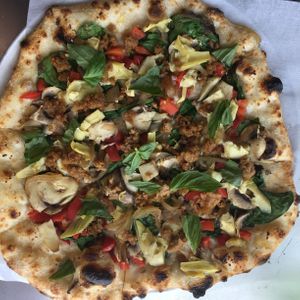 Garlic/oil with lots of veggies as well as beyond meat sausage.  at Create A Pizza in Rochester