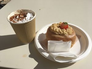 Pumpkin and spice coffee and a peanut butter and jelly donut. at Scoop 'n Dough in Lisbon