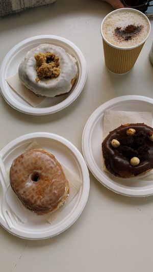 pictured here are the basic original doughnut, apple crumble and hazelnut chocolate  at Scoop 'n Dough in Lisbon