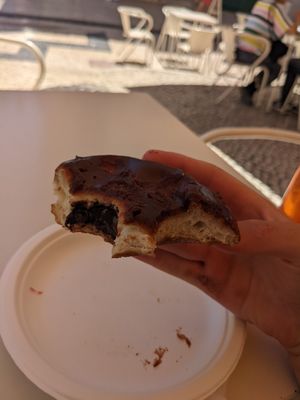 Chocolate hazelnut doughnut with a disappointing amount of filling at Scoop 'n Dough in Lisbon