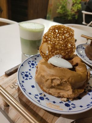 Matcha latte and caramel doughnut at Scoop 'n Dough in Lisbon