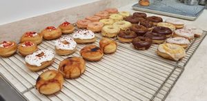 A batch of freshly prepared vegan doughnuts. From the signature Creme Brulee to Strawberry Lemon, Scoop n Dough offers a variety of flavours at Scoop 'n Dough in Lisbon