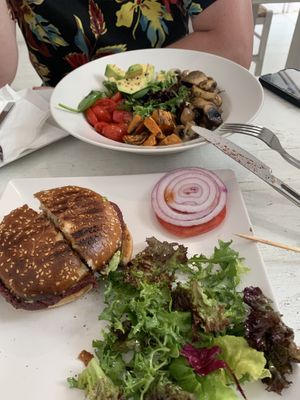 Vegan Bowl (top) has tomatoes, sweet potato, greens, avocado, and mushrooms. Vegan burger (bottom) has beets and (Greek) barbecue sauce with salad. Both- very high quality/delish! at Healthylicious in Mykonos