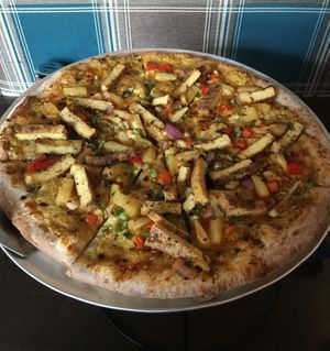 Fire Breathing Dragon pizza. So good I ate an entire medium sized pizza. Sweet chili sauce, jerk tofu, pineapple salsa & vegan RiNOTa cheese. at Pizza Luce in Eden Prairie