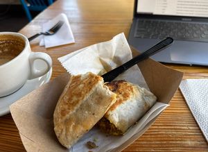 Oat milk latte & vegan breakfast burrito   at Full Stop Station in Louisville