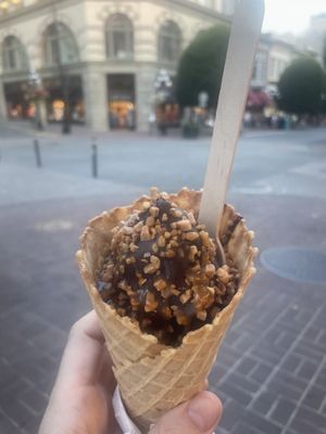 Mini cone vegan vanilla soft serve and chocolate dip with some nuts  at Chocolat Favoris in Victoria