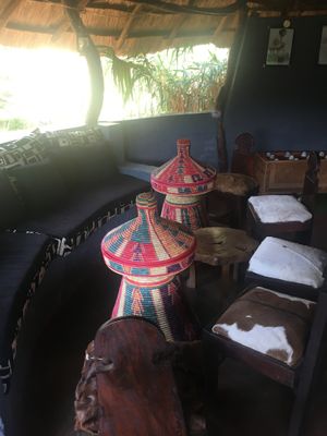 Traditional seating area under straw hut.  at Seble in Lilongwe