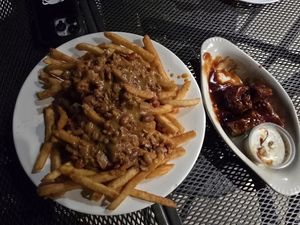Chili cheese fries (full), and seitan wings with thai bbq (comes with 8) at 10th Street Diner in Indianapolis