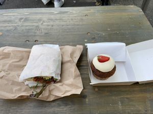 Vegan seitan panini and a carrot cupcake with frosting  at Bønnespiren in Stavanger