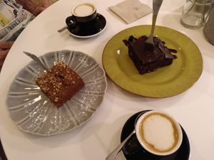 A couple of vegan cakes and two macchiatos with oat milk at Urbano Specialty Coffee in Madrid