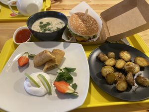 Potato wedges, cheeseburger (with Beyond patty), soup and sweet Crêpes with apples   at Loving Hut in Moscow