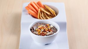Southwest Black Bean Hummus- house-made zesty black bean hummus.  Can be vegan if you take off the cheese.  Chips are gluten free (seed based) at The Spoon in Provo