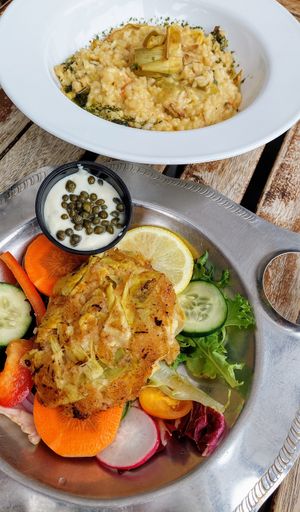 Lemon basil risotto and crab cake made of artichokes at Blacksmith in Berlin