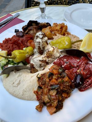 Choice of 8 dishes for two (all vegan), note that the waiter let us know that the bread was not vegan. Great ambiance and outdoor seating!  at Chez Marianne in Paris