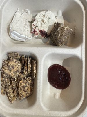 Flight of cheese with seeded crackers  at Rebel Cheese in New York City