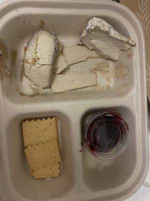 3 cheeses platter after some was eaten   at Rebel Cheese in New York City