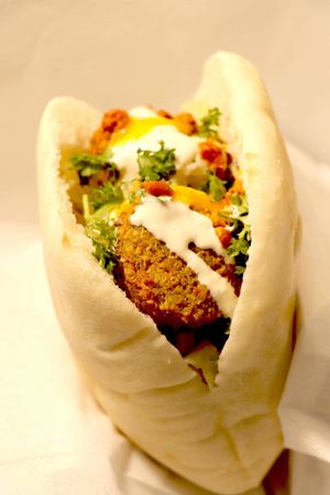 Falafel sandwich- Pita bread stuffed with fresh homemade falafel and fresh salad. Topping with your choice of sauce; hummus, tahini, chili, and Indian mango sauce. at Aaida Falafel - MBK in Bangkok