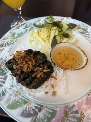 tofu stuffed in betel pepper leaves with rice noodles  at Vegan Chay in Munich