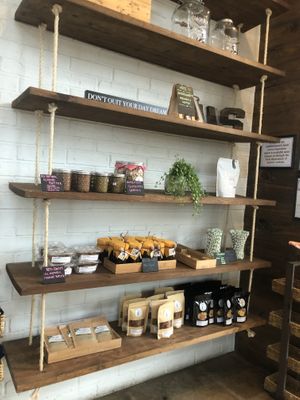 estante con algunas mantequillas veganas  at JuiceUs in Brownsville