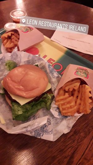 Vegan "Love Burger" with baked waffle fries. at LEON - Temple Bar in Dublin
