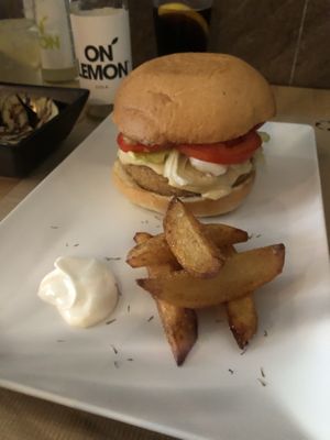 Seitan and truffle burger with FIVE fries  at Melocotón Vegan Burger in Barcelona