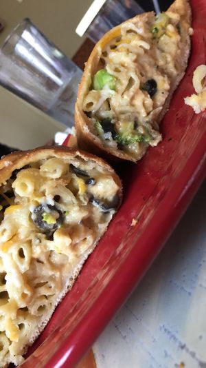 Vegan Mac n Cheese Calzone (w black olives and broccoli) at Brick Road Pizza Co in Grand Rapids