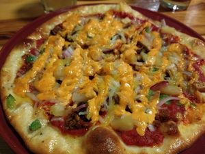 Vegan surprise pizza (thin crust) at Brick Road Pizza Co in Grand Rapids