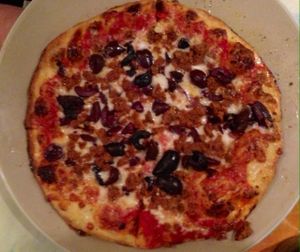 pizza with veggie sausage & kalamata olives at Brick Road Pizza Co in Grand Rapids