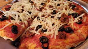 vegan sasuage, black olives, and basil at Duneland Pizza in Chesterton