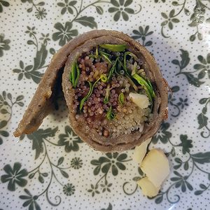 Buckwheat pancake filled with buckwheat sprouts, closeup.
(Memilsun Jeonbyeong 메밀순 전병) at Memiljaengi - 메밀쟁이 in Seoul
