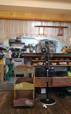 Interior of restaurant, view towards the kitchen at Memiljaengi - 메밀쟁이 in Seoul