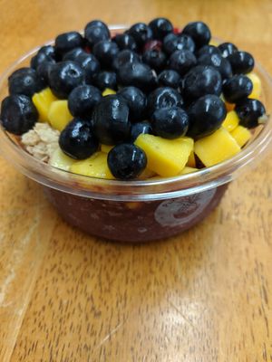 Vegan acai bowl with mango, strawberries and blueberries at Playa Bowls in Glassboro
