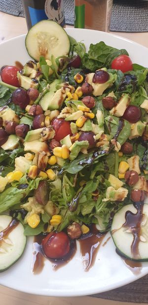 Vegan salad. Corn, hazelnuts, pineapple, grape and avocado at Papaya in Faro
