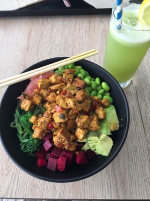Bowl with tofu, edamame, seaweed salad, pickle ginger, avocado, beetroot and brown rice. Celery juice  at Poké Lagos in Lagos
