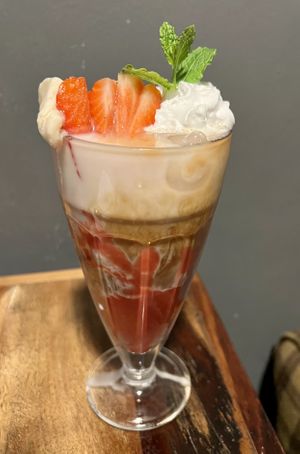 Premium iced coffee with Strawberry purée and ice cream 🍓  at Bio Cafe in Aberdeen